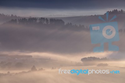 Morning Fog In The Alps Stock Photo