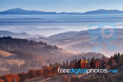 Morning Mist In Mountains. Sunrise And Autumn Mist Over The Hill… Stock Photo