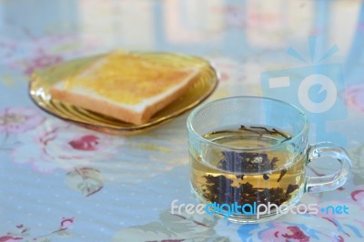 Morning Tea With Bread On The Table Stock Photo