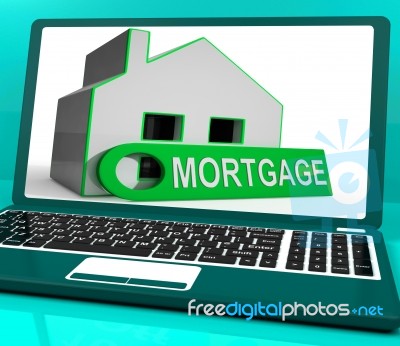 Mortgage House Laptop Shows Owing Money For Property Stock Image