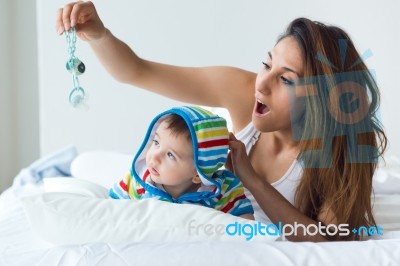 Mother And Baby Playing And Smiling At Home Stock Photo