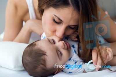 Mother And Baby Playing And Smiling At Home Stock Photo