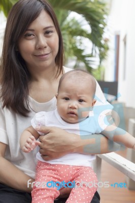 Mother And Baby Relaxing At Home Use For Infant And Motherhood H… Stock Photo