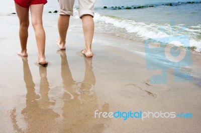 Mother And Daughter Are On The Beach Stock Photo