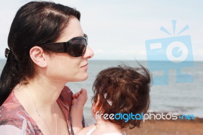 Mother And Daughter At The Beach Stock Photo