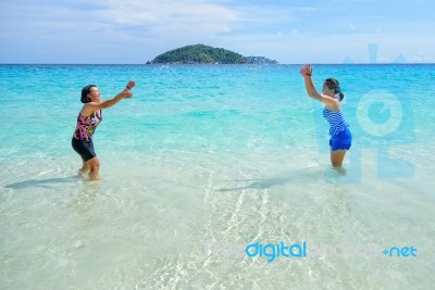 Mother And Daughter Happy On The Beach Stock Photo