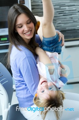 Mother And Daughter Having Fun In The Kitchen Stock Photo