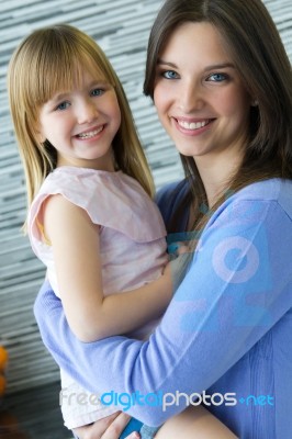 Mother And Daughter Having Fun In The Kitchen Stock Photo