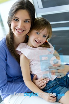 Mother And Daughter Having Fun In The Kitchen Stock Photo