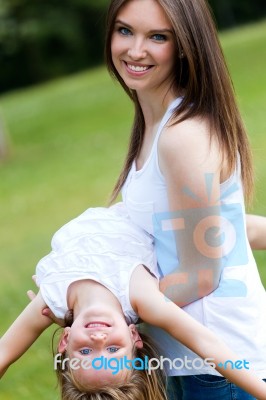 Mother And Daughter Having Fun Outdoors Stock Photo