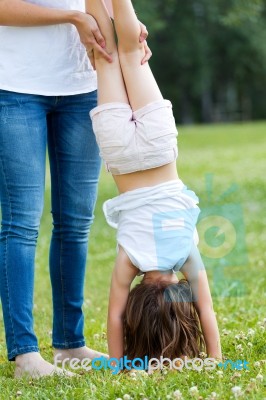 Mother And Daughter Having Fun Outdoors Stock Photo