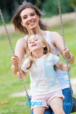 Mother And Daughter Having Fun Outdoors Stock Photo