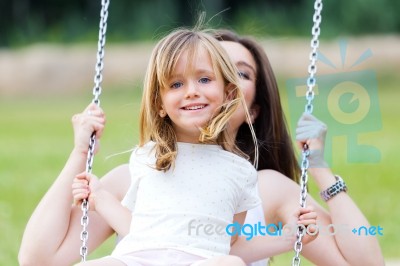 Mother And Daughter Having Fun Outdoors Stock Photo