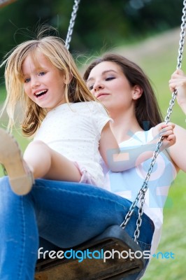 Mother And Daughter Having Fun Outdoors Stock Photo