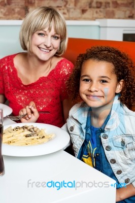 Mother And Daughter In A Restaurant Stock Photo