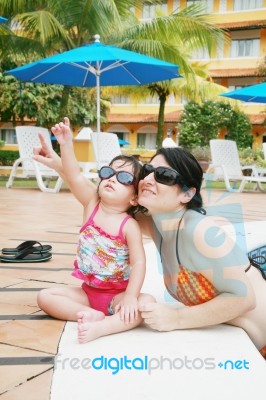 Mother And Daughter In Pool Stock Photo