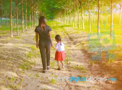 Mother And Daughter On Sunset Watching On Sky Stock Photo