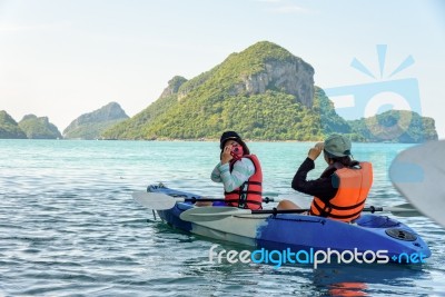 Mother And Daughter Take Pictures On Kayak Stock Photo