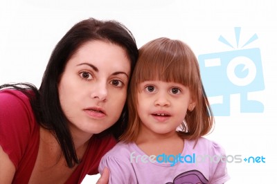 Mother And Daughter Watch TV Stock Photo