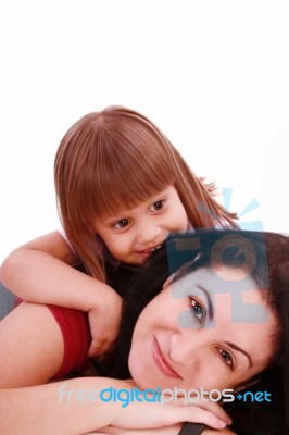 Mother And Her Baby Girl Lying Stock Photo