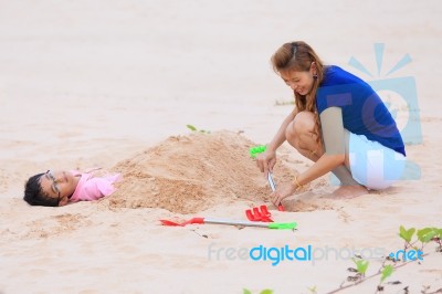 Mother And Son Are Playing On Tropical Beach Stock Photo