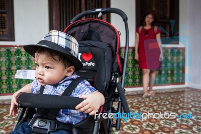 Mother And Son Standing At The House Stock Photo