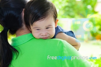 Mother Carrying And Comfort Her Daughter Stock Photo