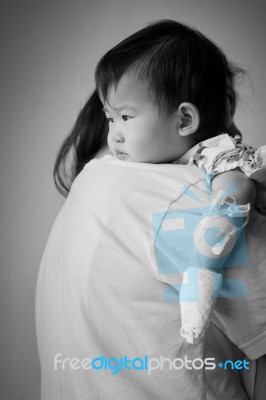 Mother Carrying Sick Baby In Hospital Stock Photo