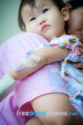 Mother Carrying Sick Baby,shallow Dof Stock Photo