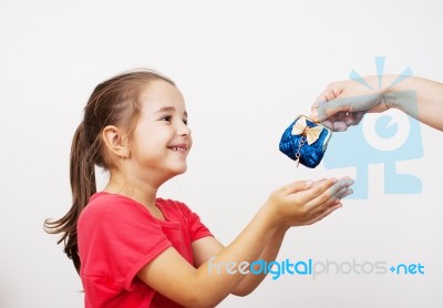 Mother Gives The Purse To A Little Girl Stock Photo