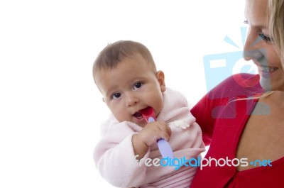 Mother Holding Her Baby Stock Photo