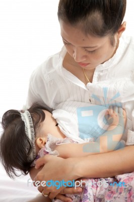 Mother Is Breast Feeding For Her Baby On White Background Stock Photo