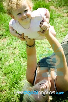 Mother Playing With Her Child Stock Photo