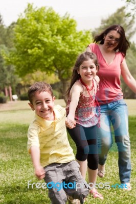 Mother Running With Children Stock Photo