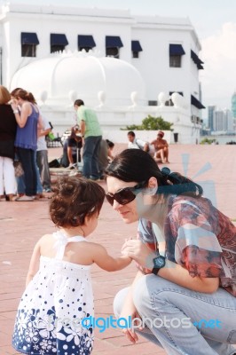 Mother Speaking To Her Child Stock Photo