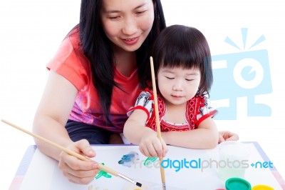 Mother With Child Girl Draw And Paint Together. Isolated On Whit… Stock Photo