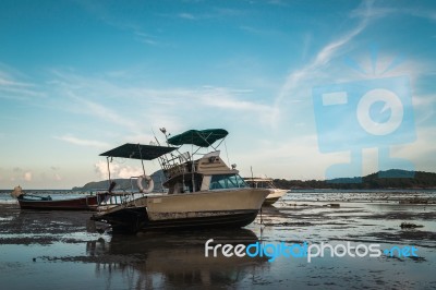 Motor Boat With Low Tide Stock Photo