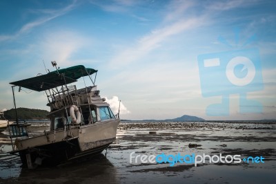 Motor Boat With Low Tide Stock Photo