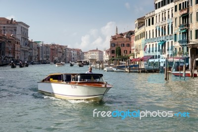 Motorboat Cruising Down The Grand Canal Stock Photo