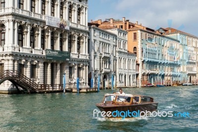 Motorboat Cruising Down The Grand Canal Stock Photo