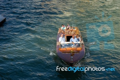 Motorboat Cruising Down The Grand Canal In Venice Stock Photo