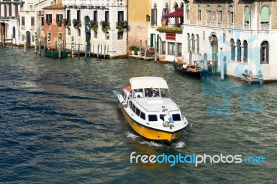 Motorboat Cruising Down The Grand Canal In Venice Stock Photo