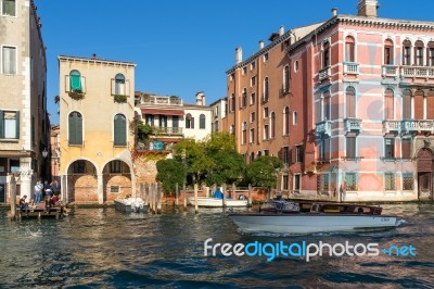 Motorboat Cruising Down The Grand Canal In Venice Stock Photo