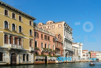 Motorboat Cruising Down The Grand Canal In Venice Stock Photo