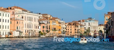 Motorboat Cruising Down The Grand Canal In Venice Stock Photo