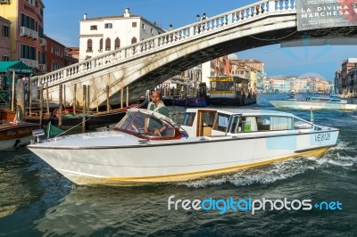 Motorboat Cruising Down The Grand Canal In Venice Stock Photo