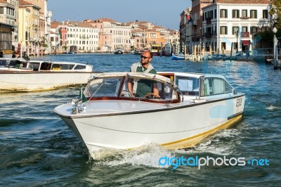 Motorboat Cruising Down The Grand Canal In Venice Stock Photo