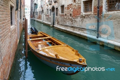 Motorboat Moored In A Canal In Venice Stock Photo