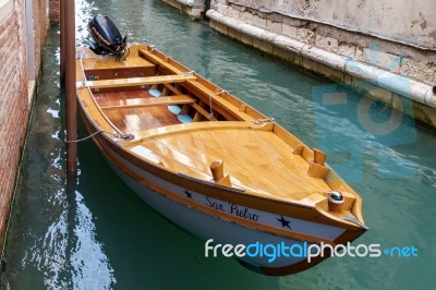 Motorboat Moored In A Canal In Venice Stock Photo