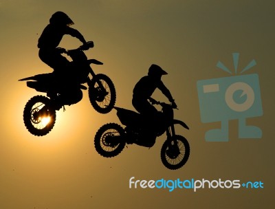 Motorcycle Jumps In The Air Stock Photo